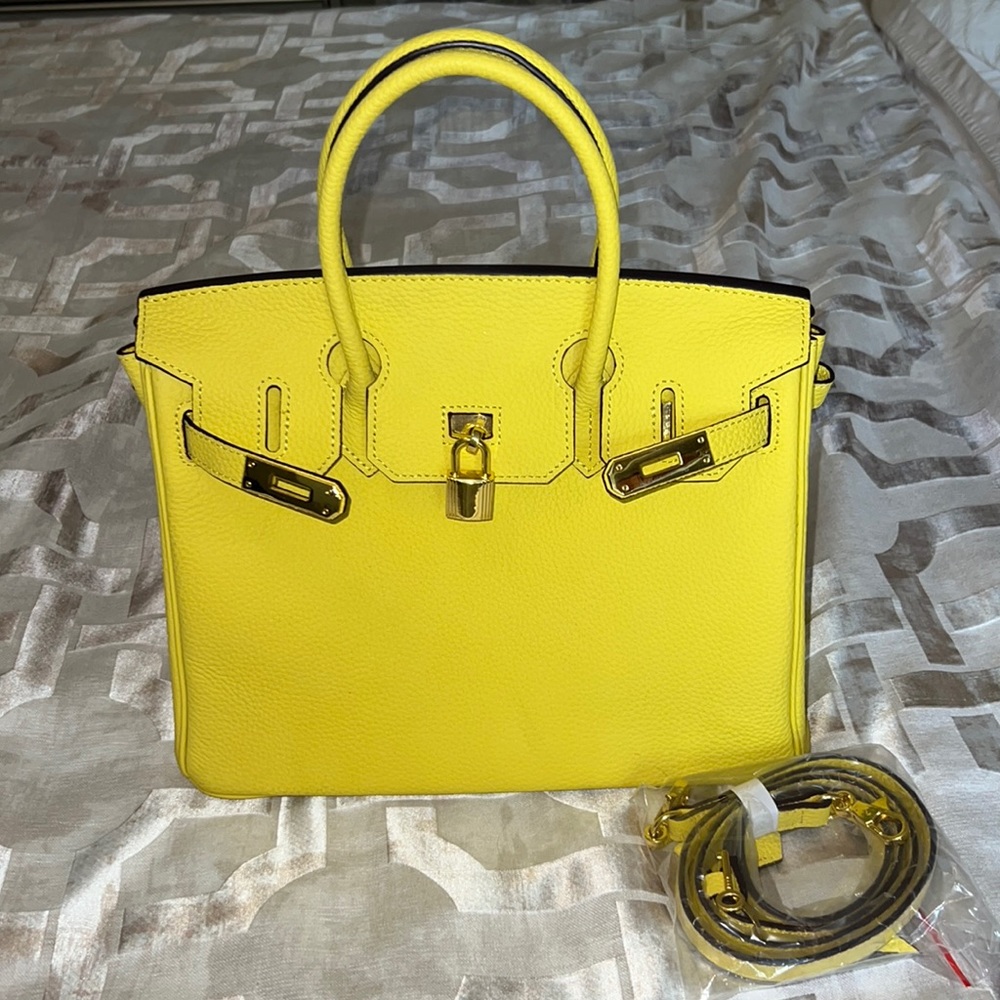 Real leather Yellow handbag comes with extra strap, key holder, & lock and key.